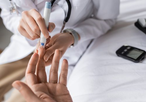 cropped-view-of-doctor-with-lancet-pen-checking-bl-2026-03-25-23-54-42-utc-web