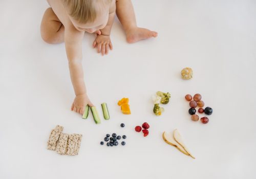 high-angle-baby-choosing-what-eat-alone