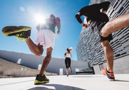 three-friends-athletes-jogging-in-a-modern-buildin-2024-09-23-06-00-29-utc