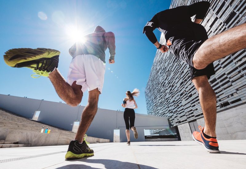 three-friends-athletes-jogging-in-a-modern-buildin-2024-09-23-06-00-29-utc